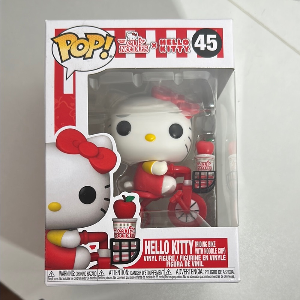 Hello Kitty Riding Bike Vinyl Figure